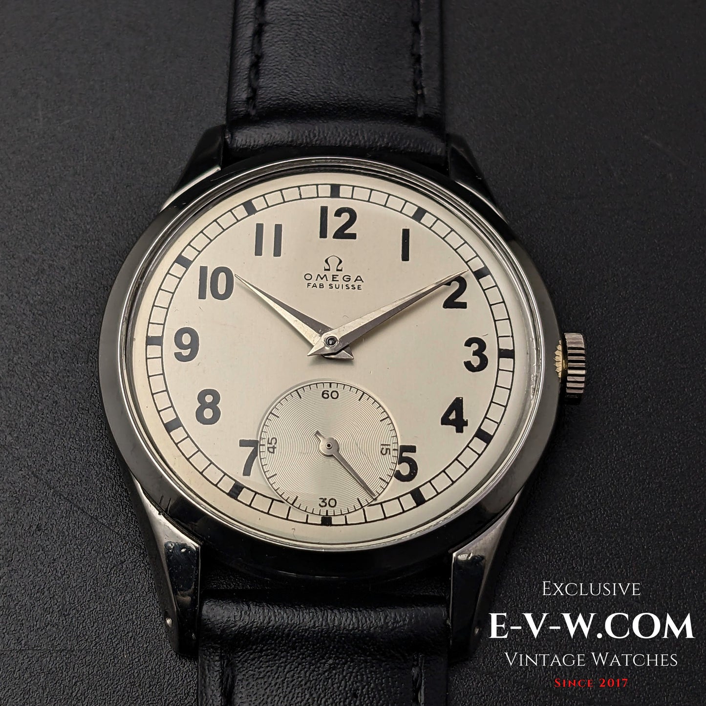 Front view of the Omega FAB SUISSE Ref. 2750-6 vintage wristwatch, showcasing its silver dial, black numerals, and subdial at 6 o’clock.