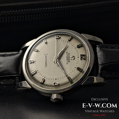 Side view of Vintage 1958 Omega Seamaster Automatic Watch showcasing domed crystal and vintage Omega logo crown.
