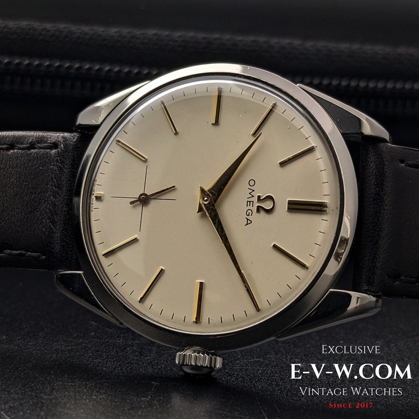 Close-up of Omega CK 2900 Vintage 1956 watch, featuring a champagne dial, gold-tone indices, and a sub-seconds dial. A rare and elegant timepiece.