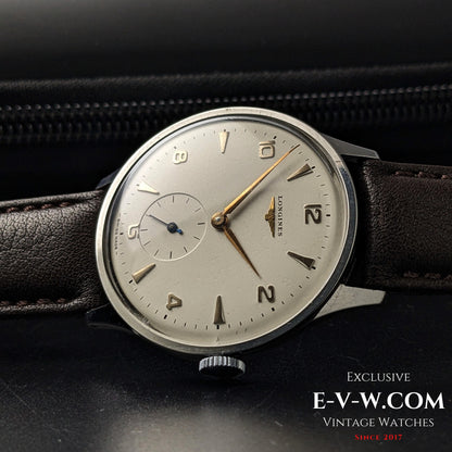 1955 Longines Jumbo Calatrava Ref 2849 displayed on leather case, featuring clean silver dial and vintage Swiss styling.
