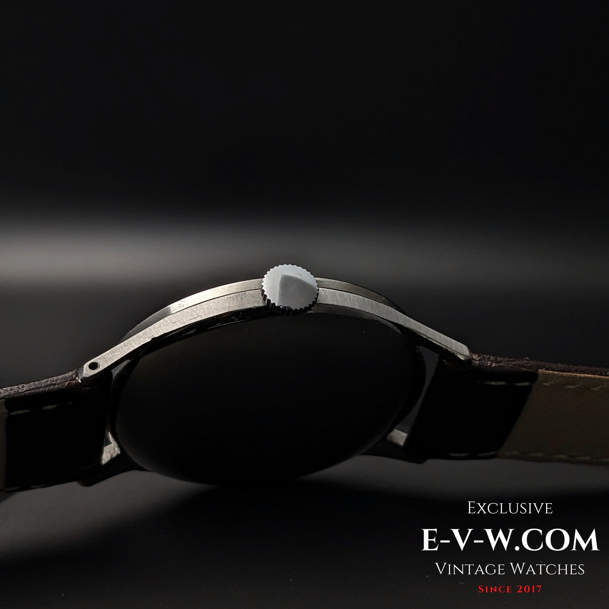 Side profile of 1955 Longines Jumbo Calatrava Ref 2849 showing slim stainless steel case and crown design.