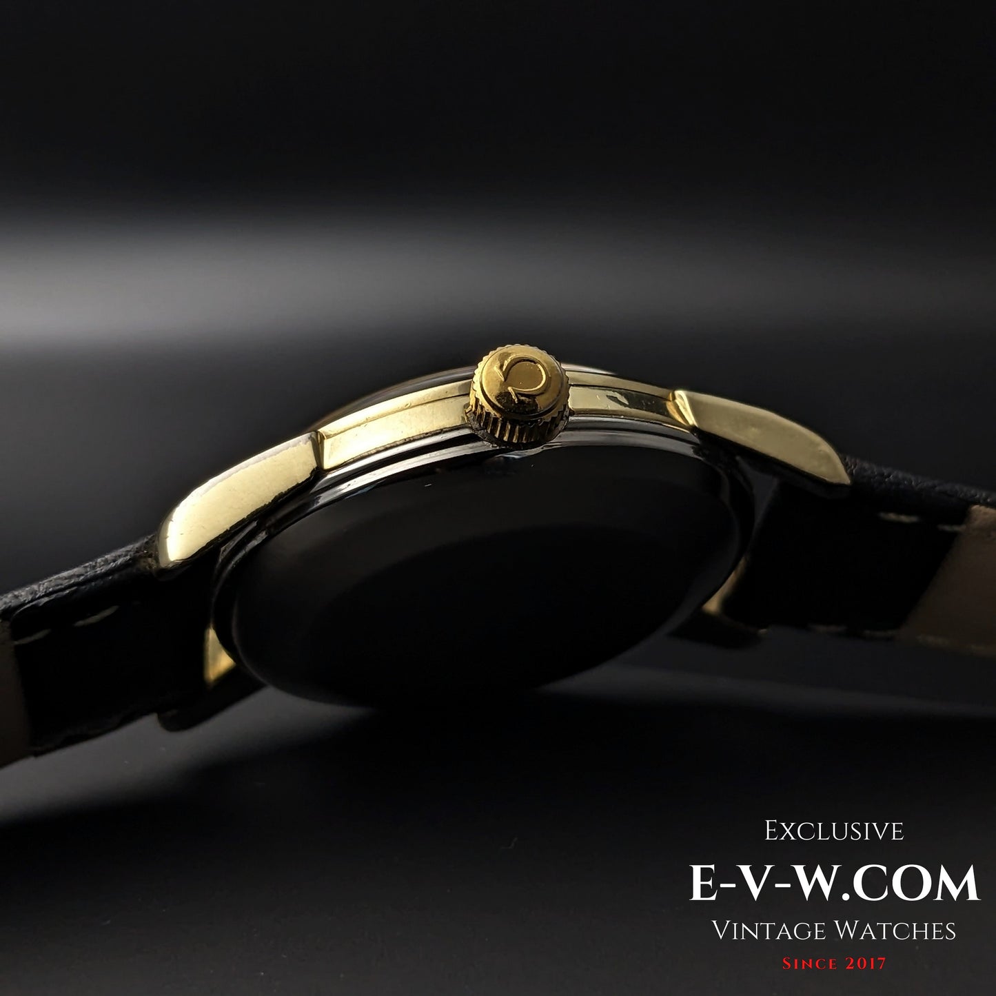 Side view of Omega Seamaster 2828-9SC Cal. 471 crown with Omega logo, highlighting gold-tone finish and slim case profile.