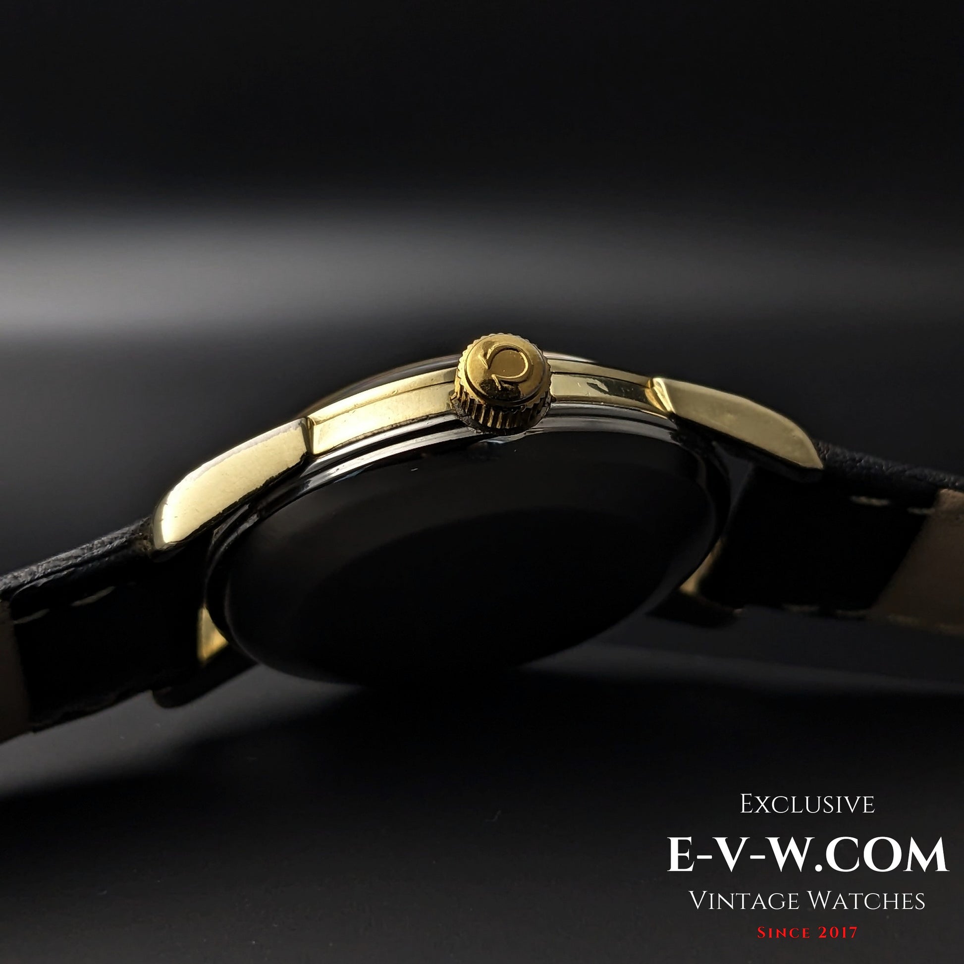 Side view of Omega Seamaster 2828-9SC Cal. 471 crown with Omega logo, highlighting gold-tone finish and slim case profile.