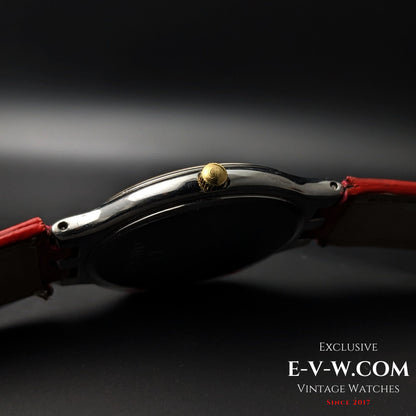 Side profile of Omega vintage watch showing gold crown and slim stainless steel case, Ref. 3961016 Cal. 1436.