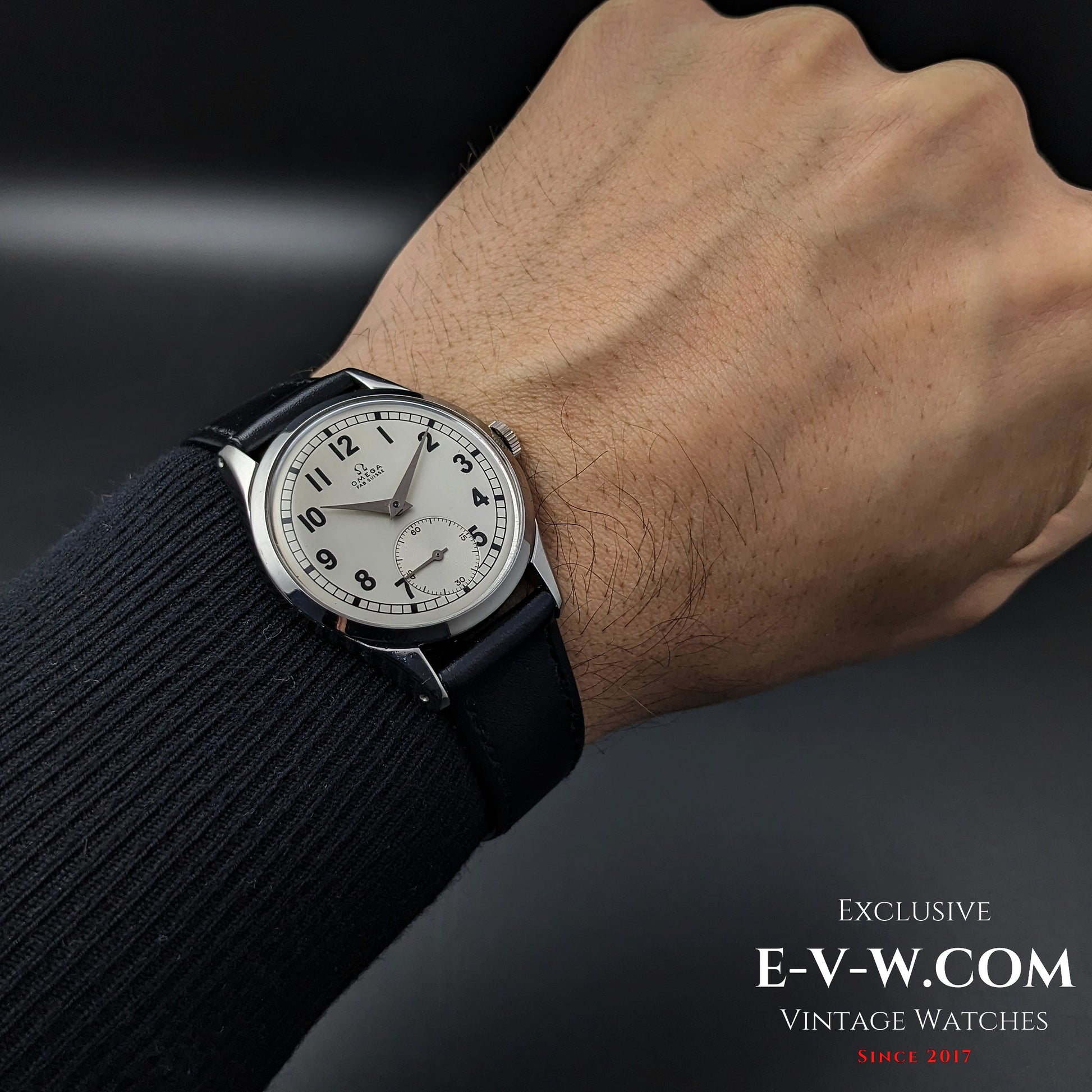 Omega FAB SUISSE Ref. 2750-6 vintage wristwatch worn on a wrist, highlighting its classic silver dial, black numerals, and subdial at 6 o’clock.