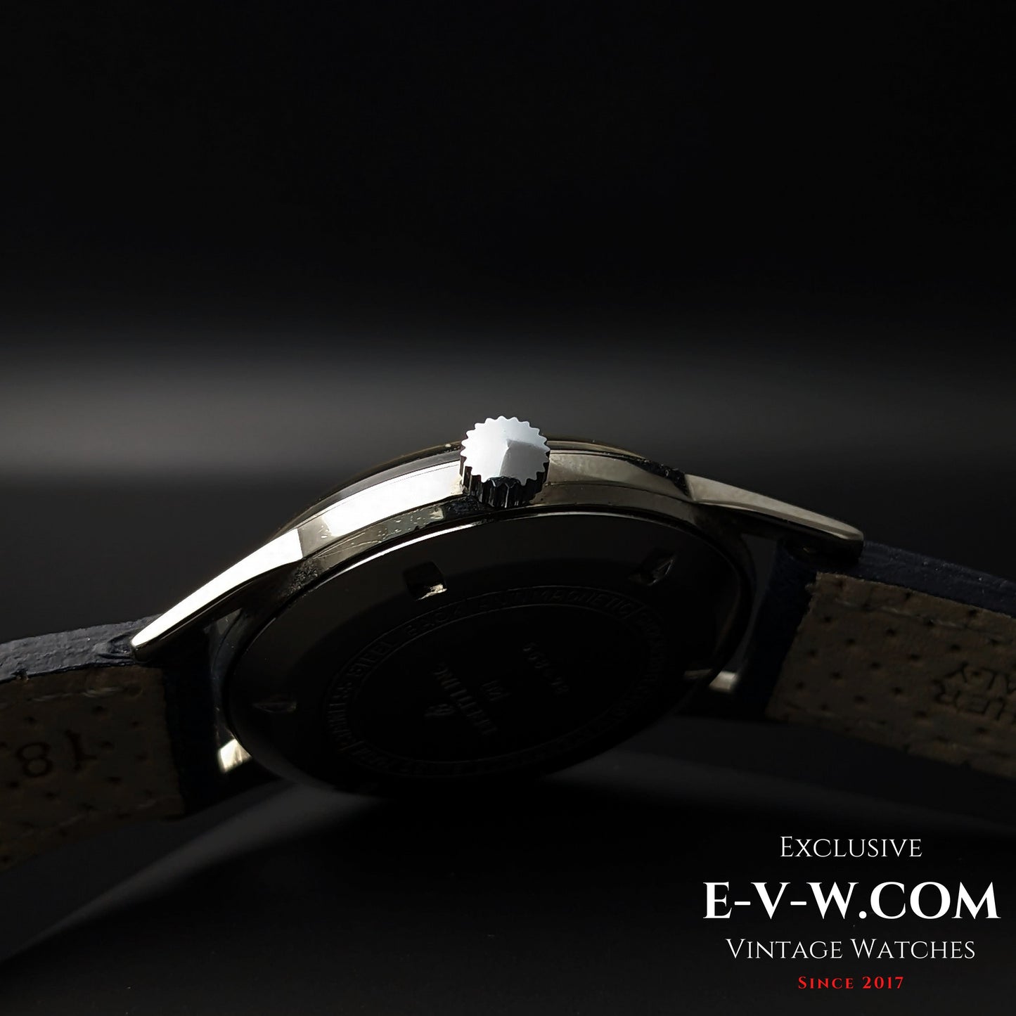 Crown detail of Vintage Breitling Geneve Cadette Watch 1960s showing polished finish and slim case profile for classic styling.