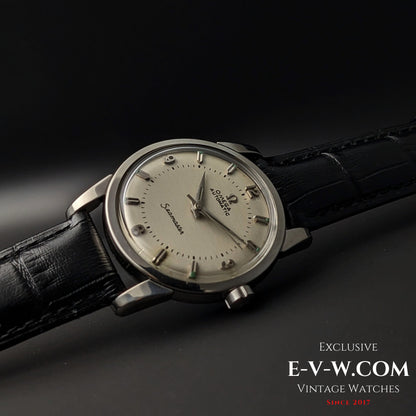 Vintage 1958 Omega Seamaster Automatic Watch angled on black background, emphasizing its classic mid-century design.
