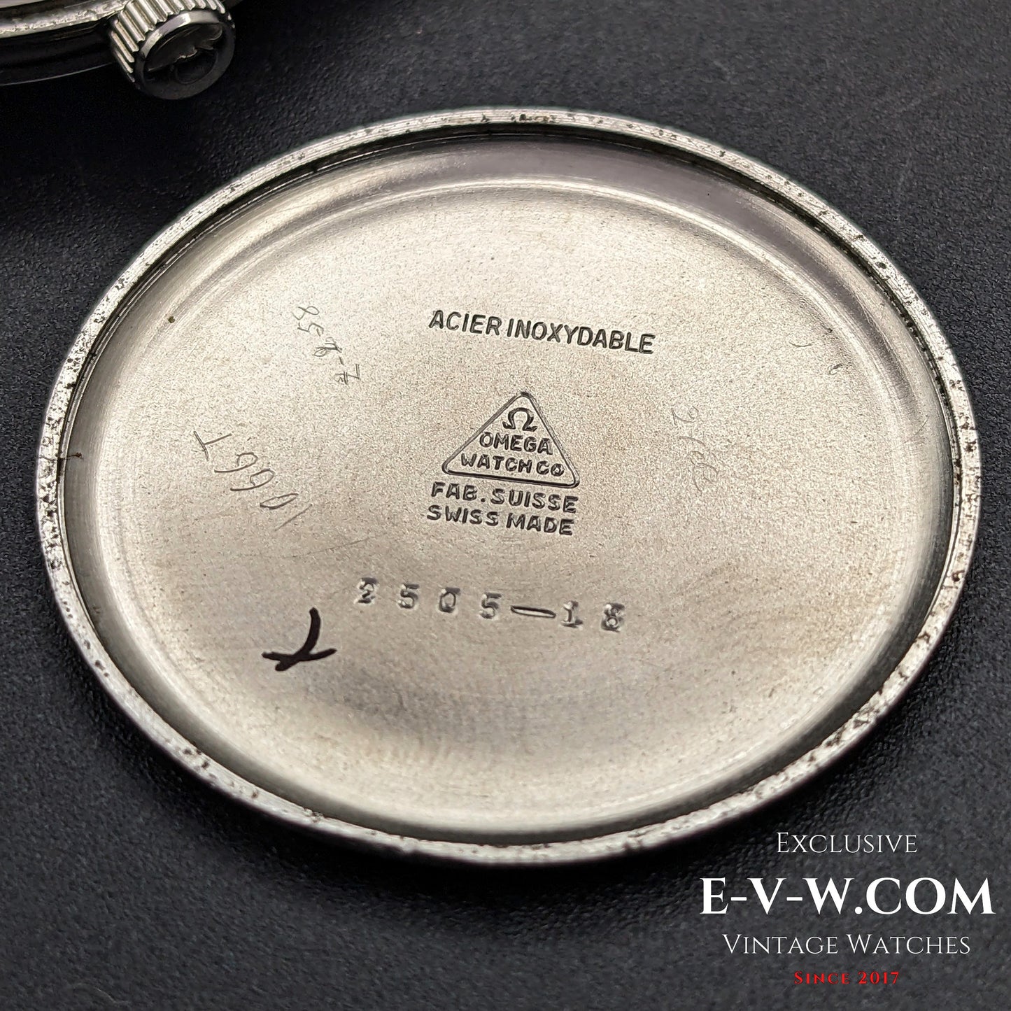 Inside case back of Omega Vintage 1952 Jumbo Ref. 2505 wristwatch, engraved with Swiss-made markings and reference number.