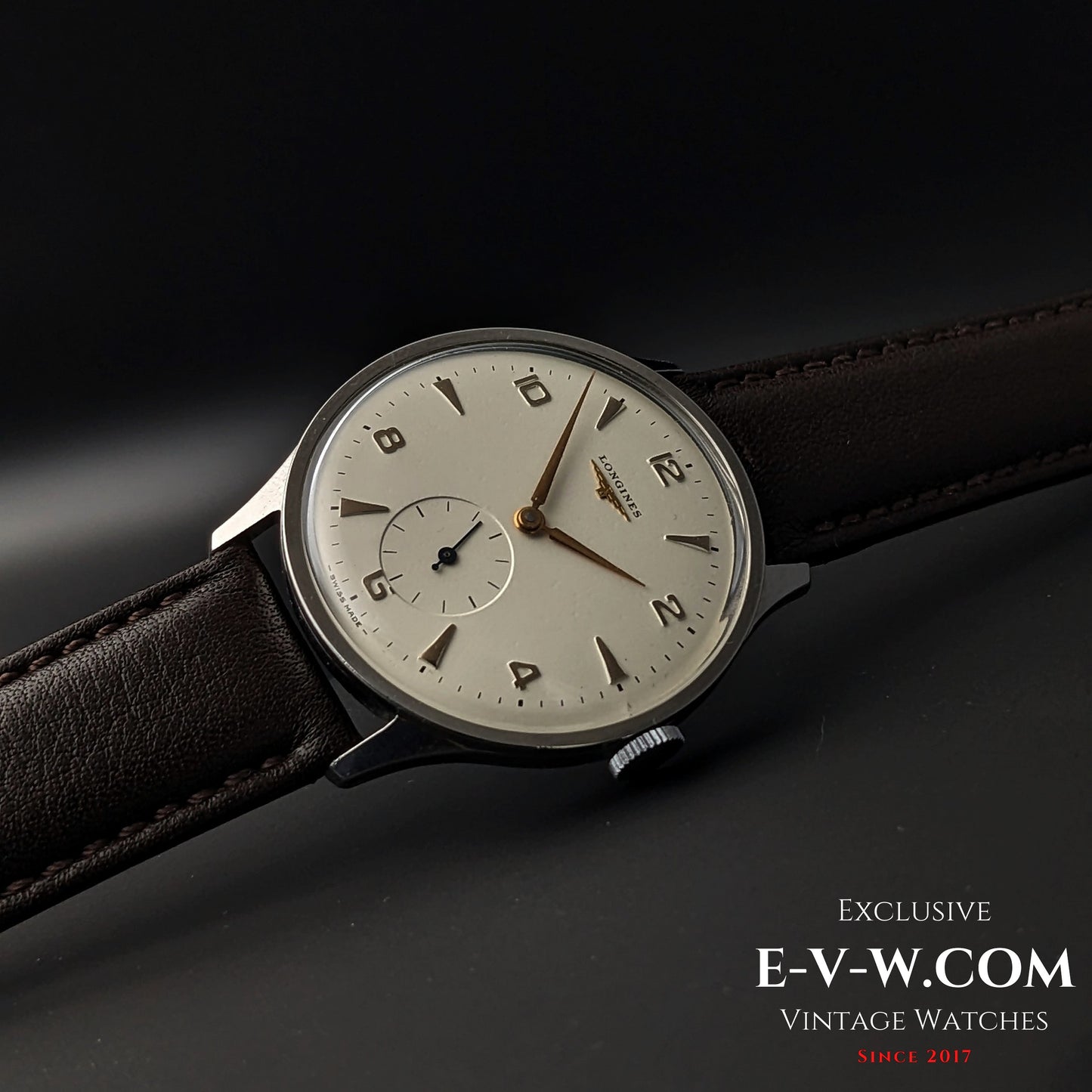 Angled view of 1955 Longines Jumbo Calatrava Ref 2849 highlighting its minimalist dial, gold-tone markers, and vintage appeal.