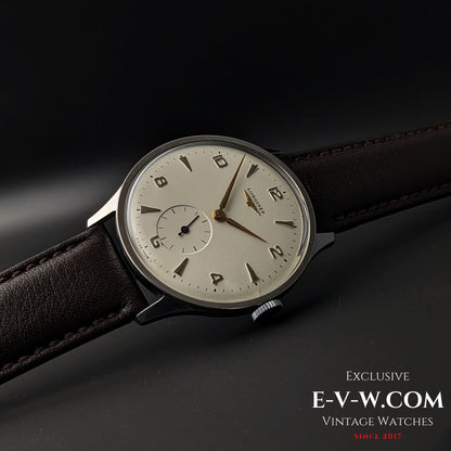 Angled view of 1955 Longines Jumbo Calatrava Ref 2849 highlighting its minimalist dial, gold-tone markers, and vintage appeal.