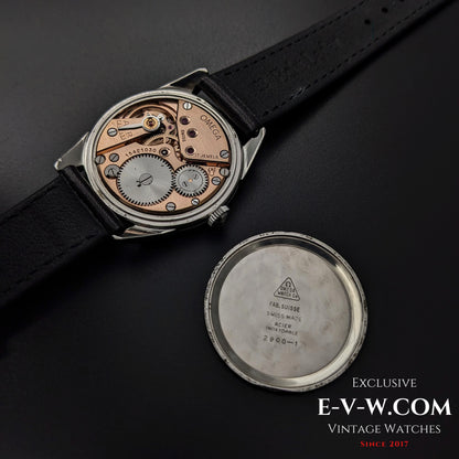 Omega CK 2900 Vintage 1956 watch with case back removed, revealing the rare Cal. 267 movement. A collectible Swiss-made timepiece.