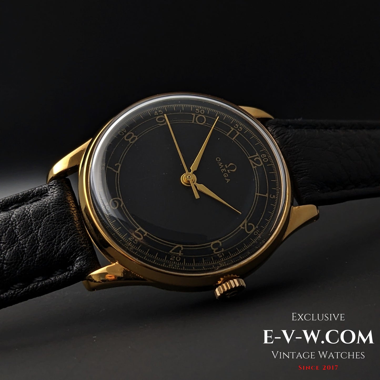 Elegant 1944 Vintage Omega WWII Gold Watch with black dial and gold-plated case, displayed on black leather strap for collectors.