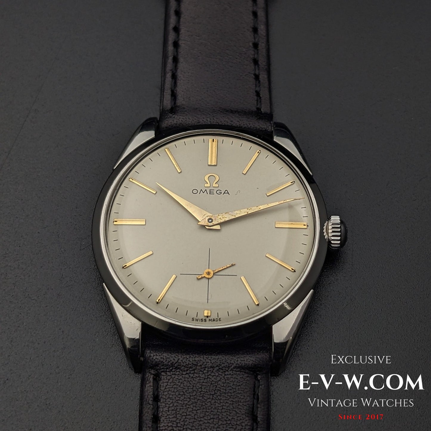 Front view of Omega CK 2900 Vintage 1956 watch, highlighting its champagne dial, gold-tone hands, and sub-seconds dial. A rare collector's item.