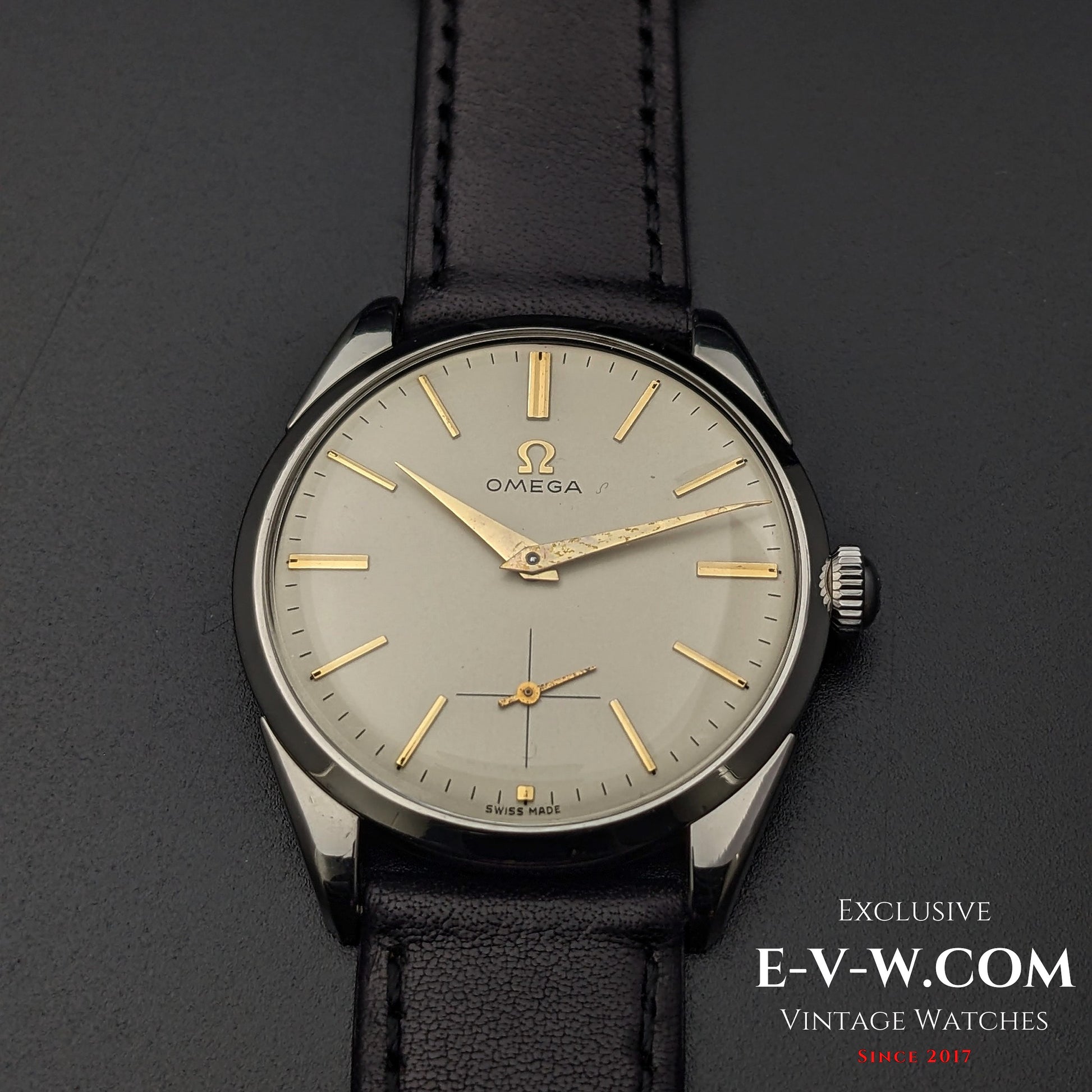 Front view of Omega CK 2900 Vintage 1956 watch, highlighting its champagne dial, gold-tone hands, and sub-seconds dial. A rare collector's item.
