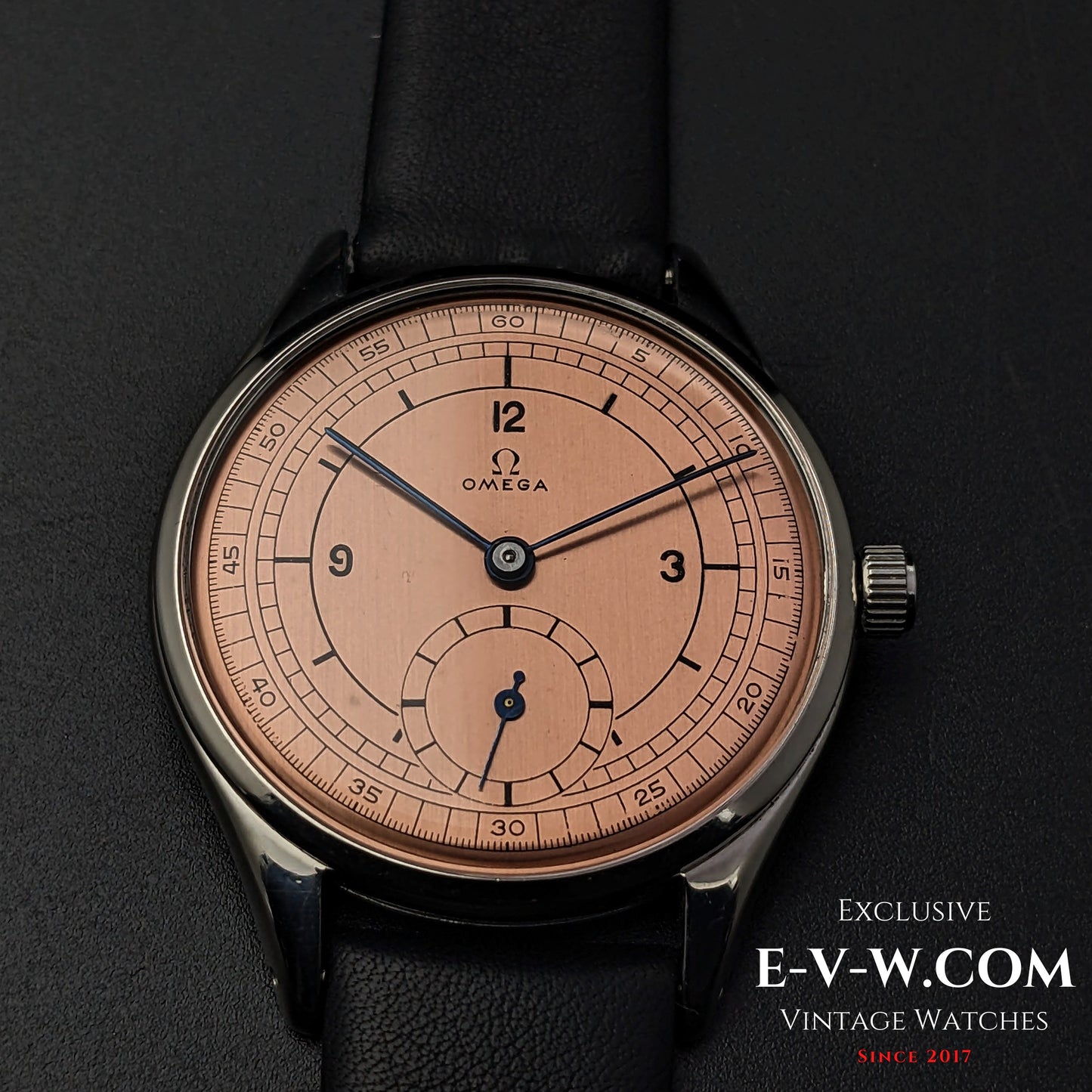 Omega Vintage 1952 Jumbo Ref. 2505 wristwatch with salmon sector dial, featuring a steel case and black leather strap.