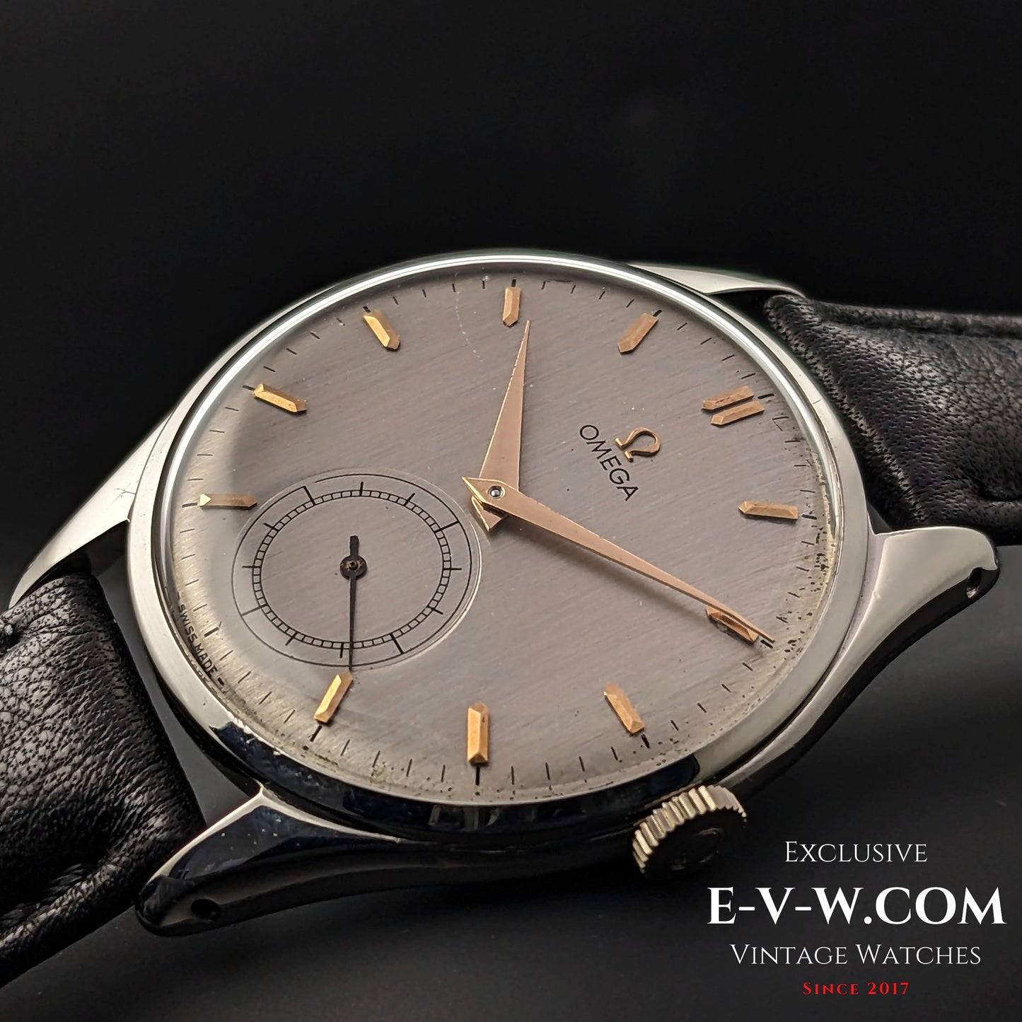 Detailed shot of Omega Jumbo 38mm Ref. 2505 20 wristwatch, showcasing its brushed silver dial, gold indices, and vintage Swiss craftsmanship.