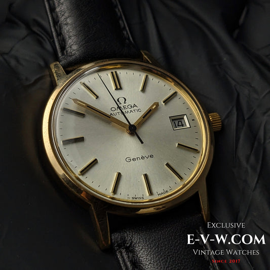 Vintage Omega Geneve 1973 Watch - Ref. 1660163 with gold case, silver dial, and black leather strap, showcasing Swiss automatic craftsmanship.