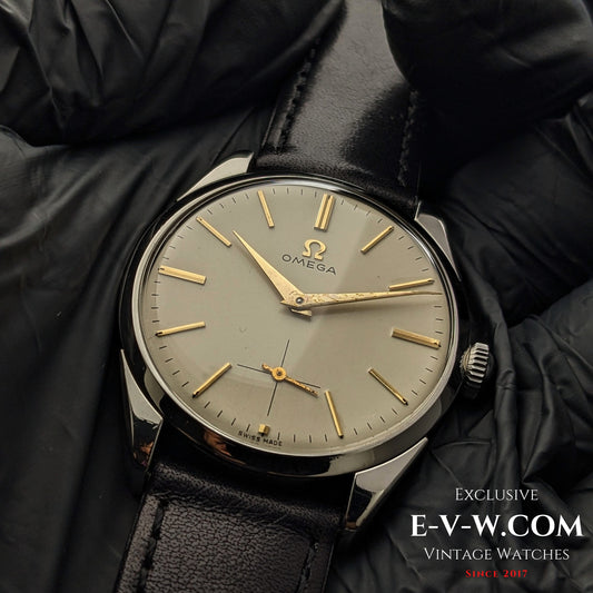 Omega CK 2900 Vintage 1956 watch with rare Cal. 267 movement, featuring a champagne dial and gold-tone indices. A timeless collectible for enthusiasts.