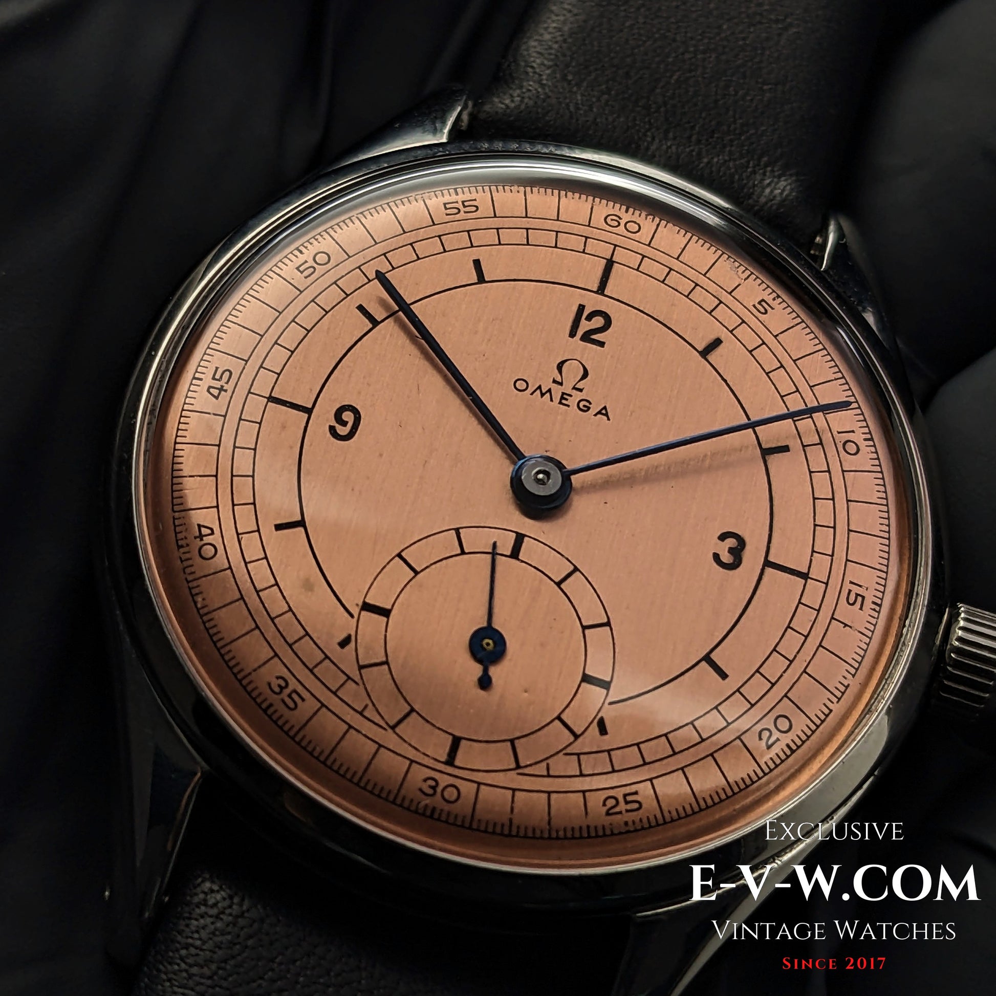 Vintage 1952 Omega Jumbo Ref. 2505 wristwatch with salmon sector dial and Cal. 266 movement. Classic steel case with black leather strap.