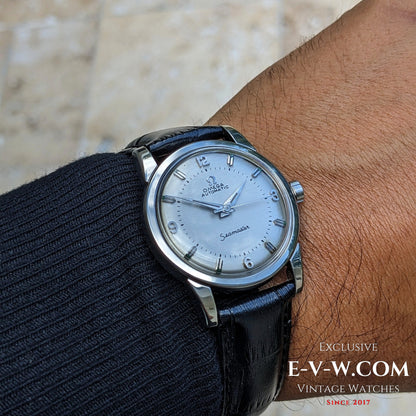 Vintage 1958 Omega Seamaster Automatic Watch worn on wrist, showcasing its classic silver dial and polished steel case.