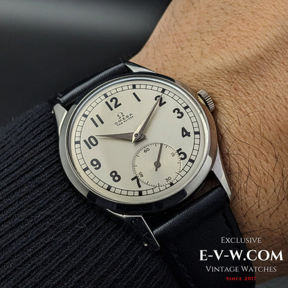 70-year-old Omega FAB SUISSE Ref. 2750-6 wristwatch worn on a wrist, showcasing its elegant silver dial and vintage design. A timeless 1954 classic.