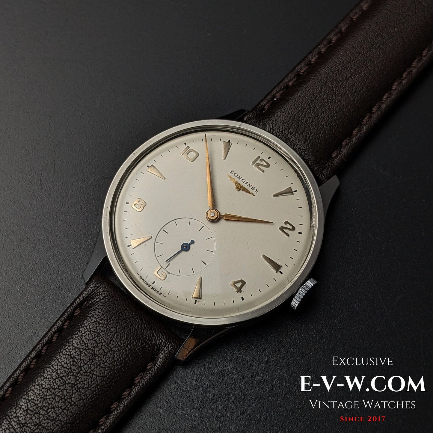 Vintage Longines Jumbo Calatrava Ref 2849 from 1955 shown on leather strap, featuring minimalist silver dial and sub-seconds display.