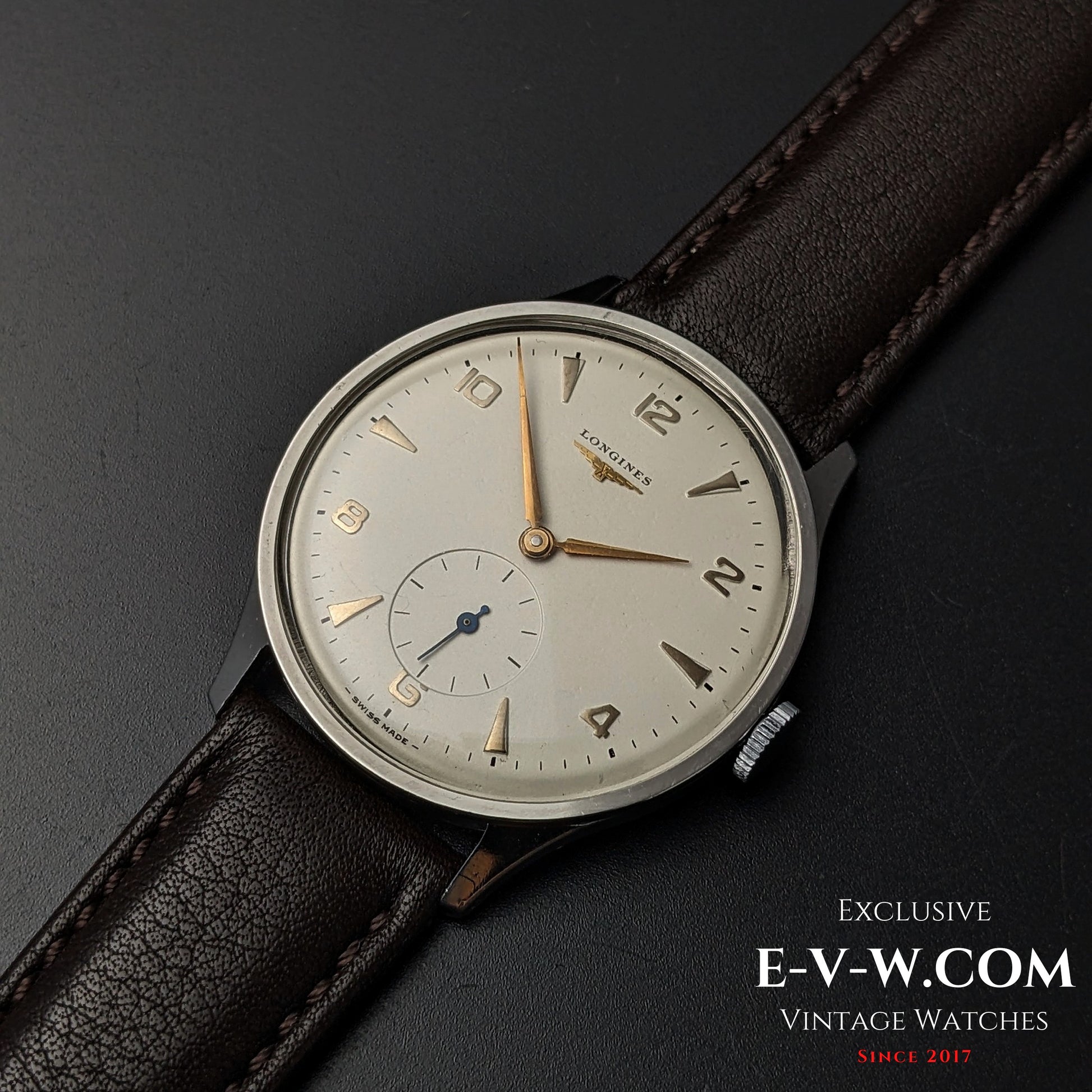 Vintage Longines Jumbo Calatrava Ref 2849 from 1955 shown on leather strap, featuring minimalist silver dial and sub-seconds display.