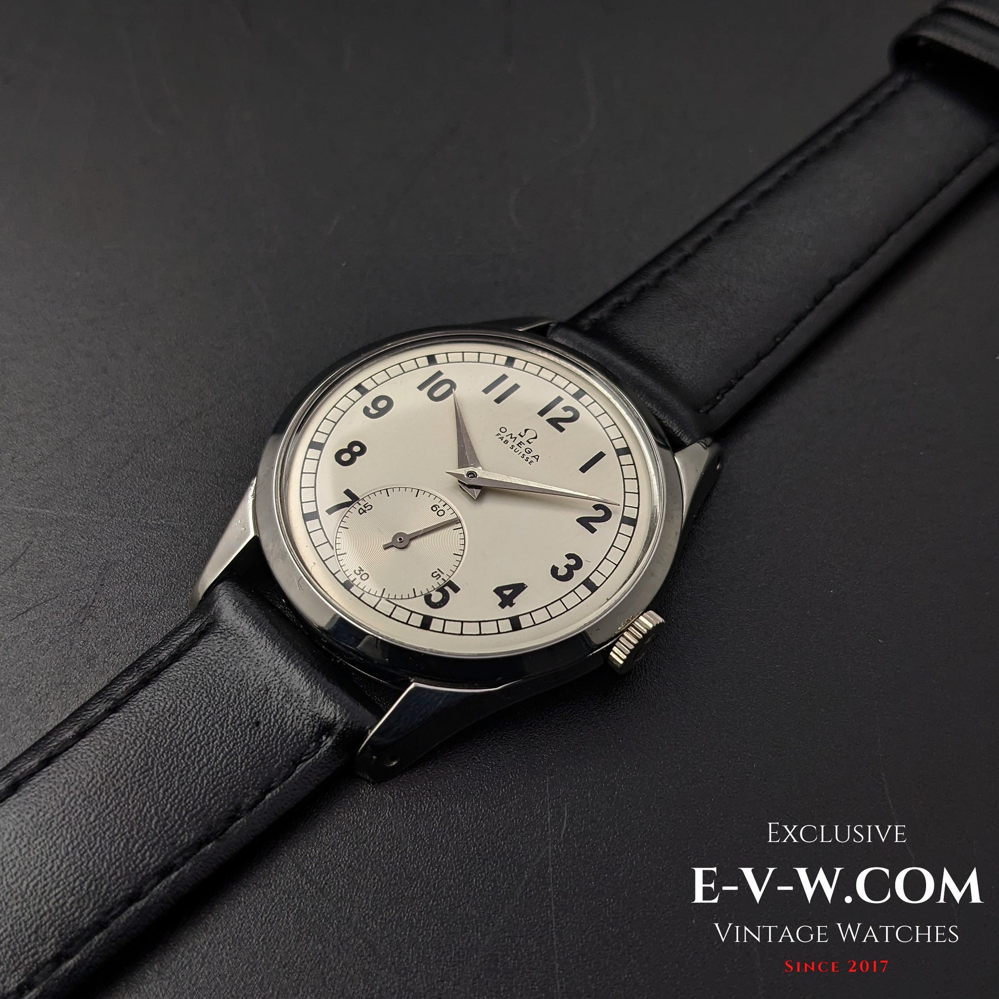 Omega FAB SUISSE Ref. 2750-6 vintage wristwatch with a silver dial and black leather strap. A 1954 classic with a subdial at 6 o’clock.