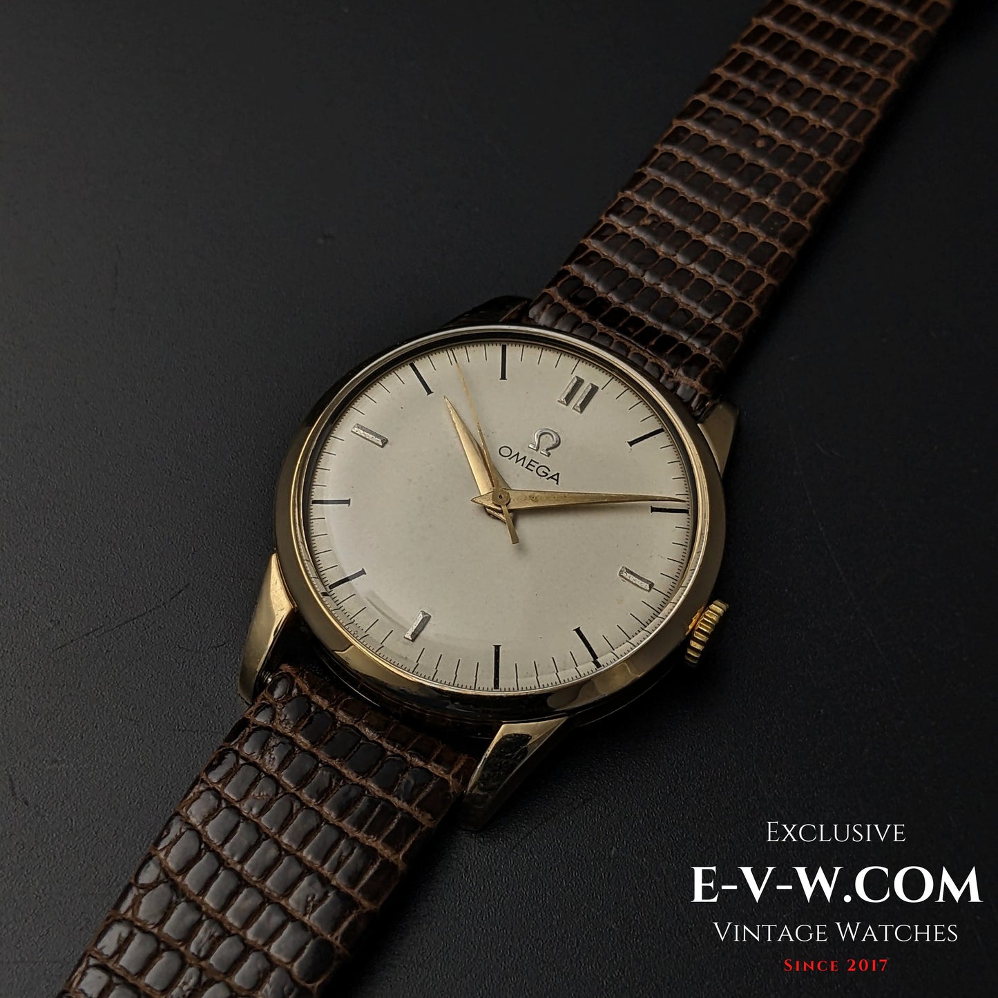 Omega Classic Gold Plaque watch with a minimalist dial and brown leather strap, a vintage timepiece from 1952 with timeless appeal.