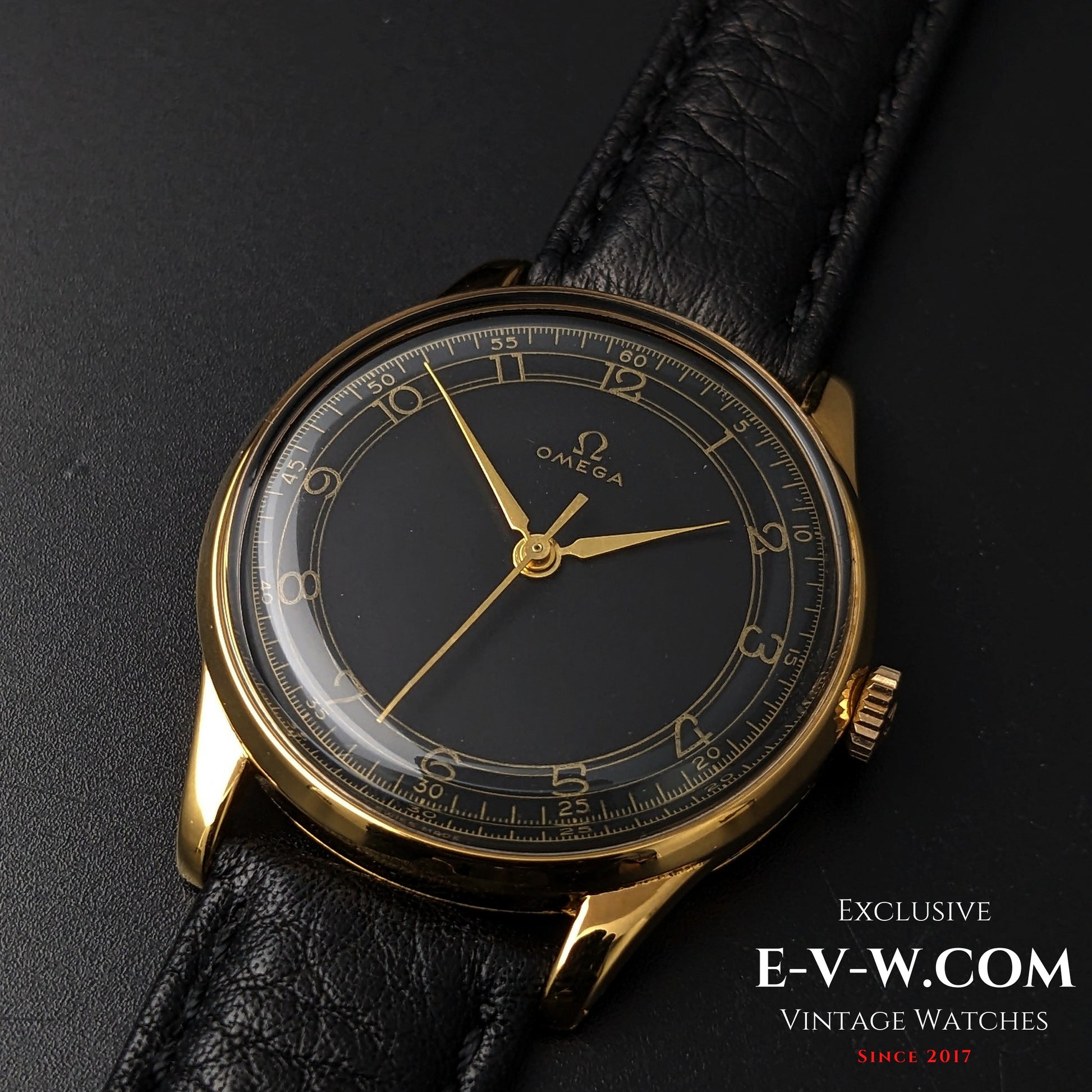 Close-up of Vintage Omega WWII Gold Watch 1944 featuring Cal. 30T2 SCPC movement and black dial with gold numerals on leather strap.