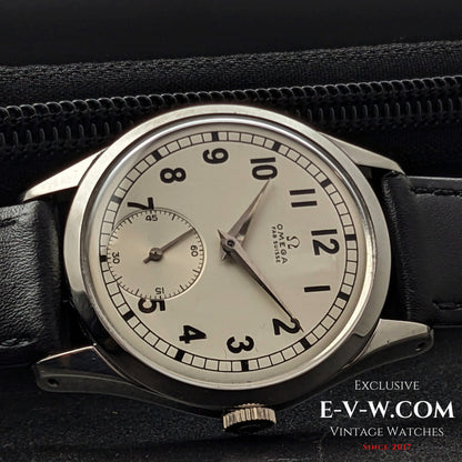 Close-up of the Omega FAB SUISSE Ref. 2750-6 vintage wristwatch in a black leather case. Features a silver dial with black numerals and a subdial.