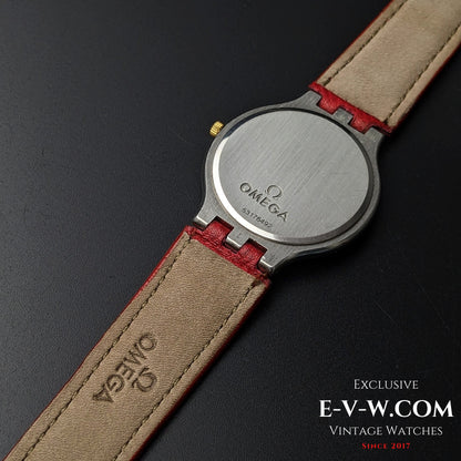 Back view of Omega vintage watch Ref. 3961016 with engraved stainless steel case back and red leather strap.