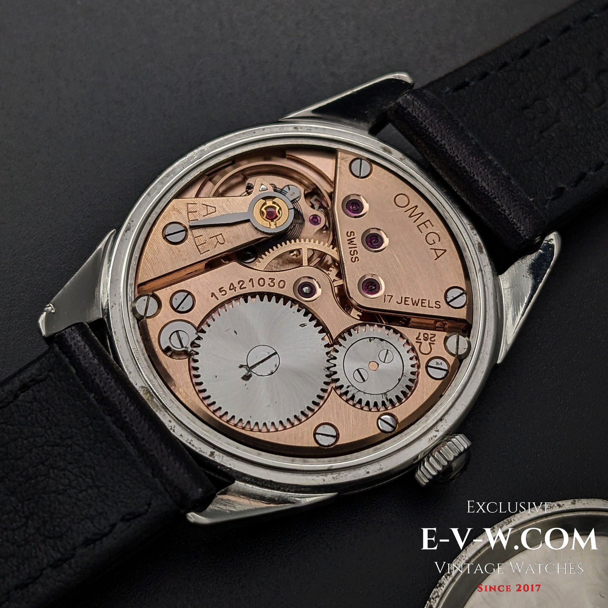 Close-up of Omega CK 2900 Vintage 1956 watch movement, featuring the rare Cal. 267 with 17 jewels. A masterpiece of Swiss craftsmanship.