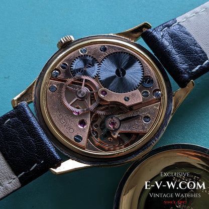 Detailed view of Omega Cal. 30T2 SCPC movement inside 1944 Vintage Omega WWII Gold Watch, highlighting intricate mechanical craftsmanship.