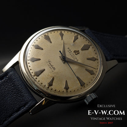 Angled view of Vintage Breitling Geneve Cadette Watch 1960s with domed crystal and aged cream dial, ideal for vintage watch enthusiasts.