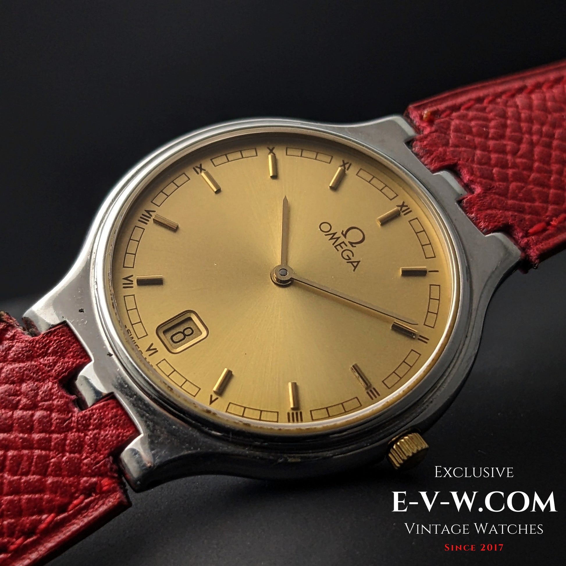 Angled view of Omega vintage 24-hour dial watch with gold-tone face and red strap, Ref. 3961016 Cal. 1436.