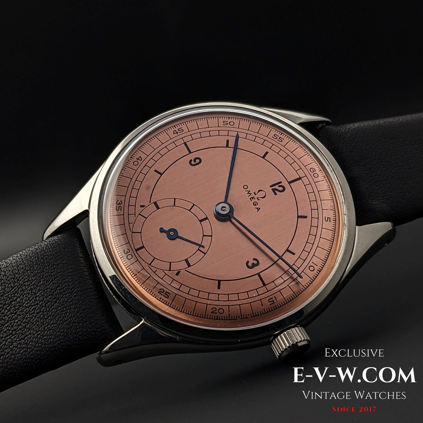 Omega Vintage 1952 Jumbo Ref. 2505 wristwatch with salmon sector dial, featuring a steel case and black leather strap.