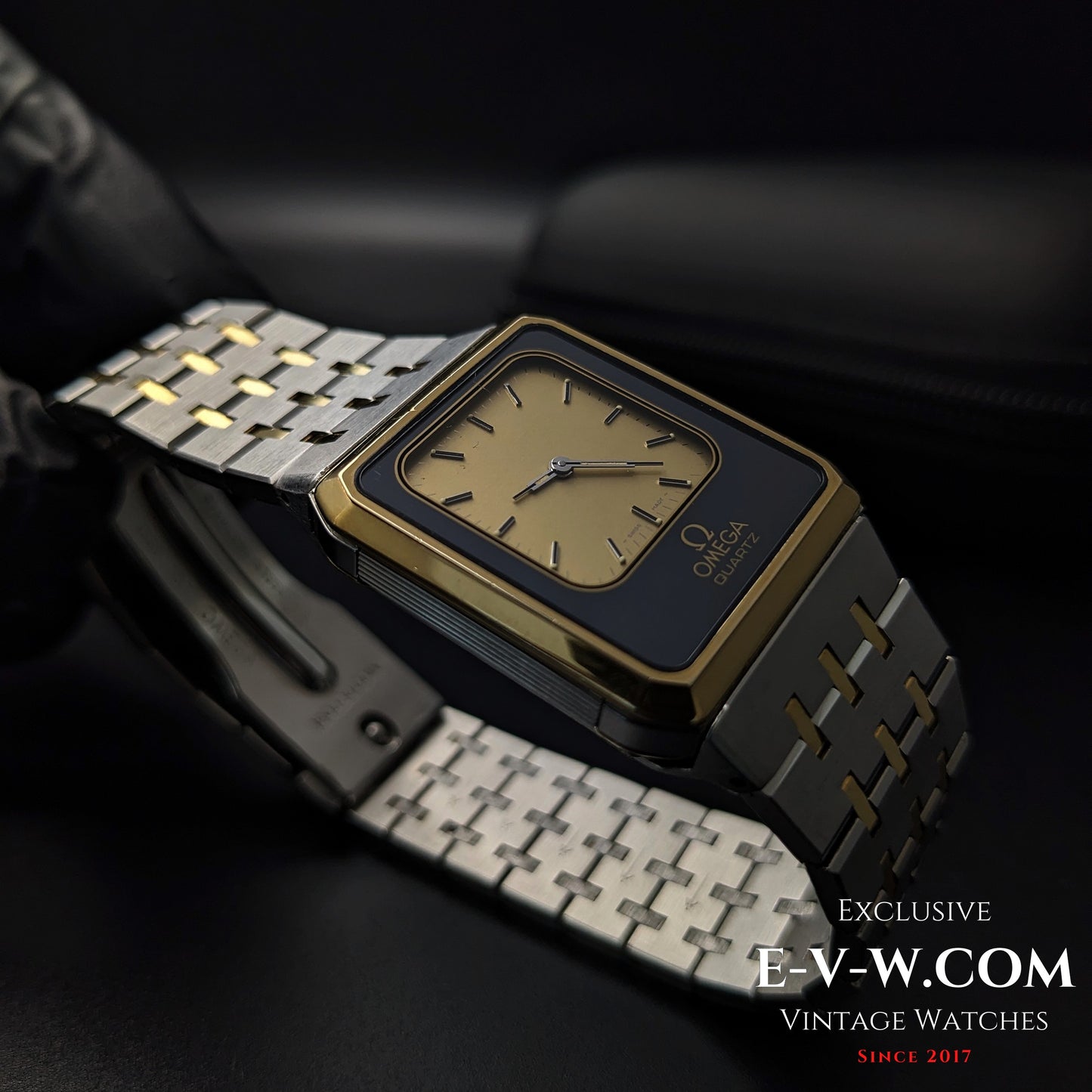 Side profile of Omega Equinoxe Reverso 1982 vintage watch showing square case and integrated bracelet in gold and steel finish.