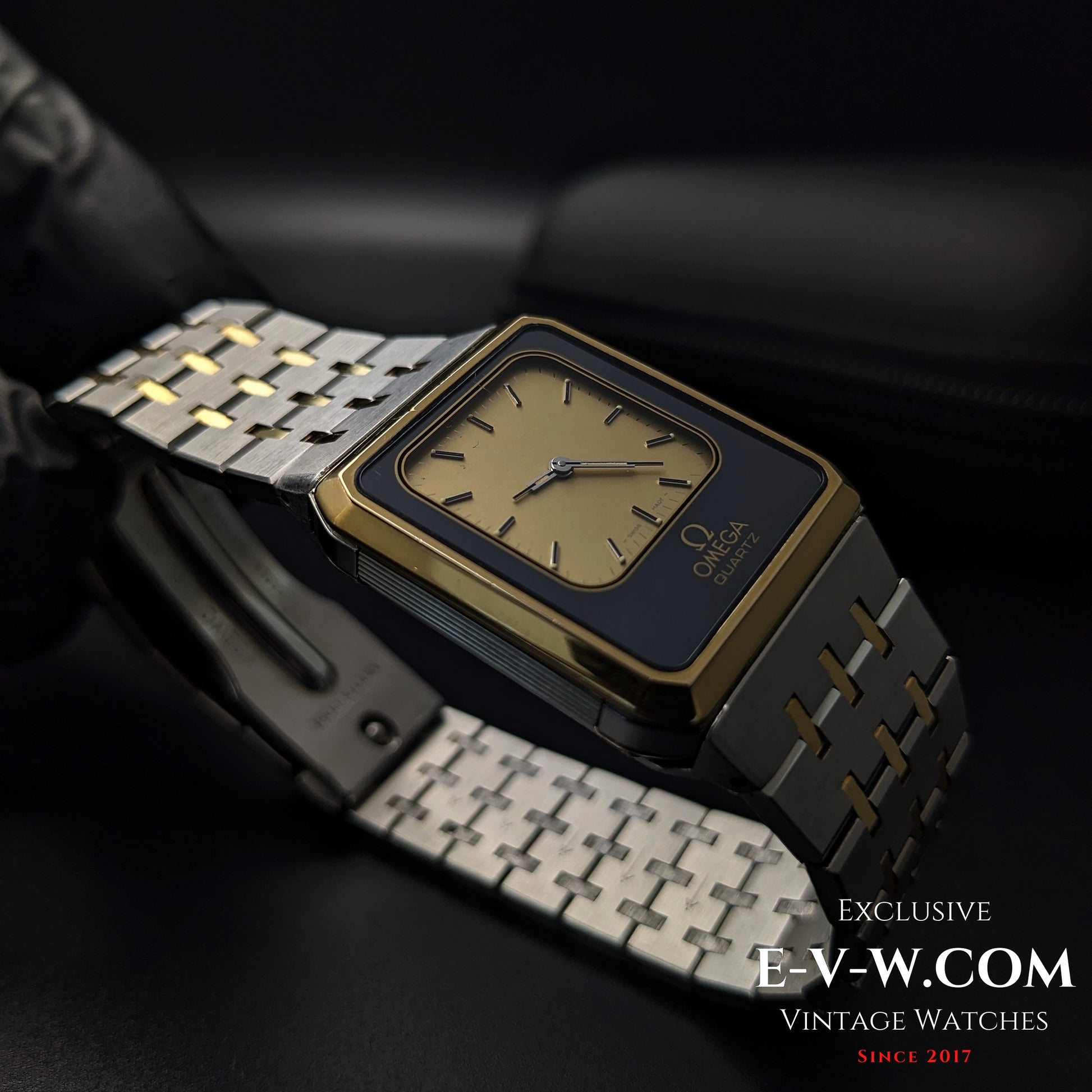 Side profile of Omega Equinoxe Reverso 1982 vintage watch showing square case and integrated bracelet in gold and steel finish.