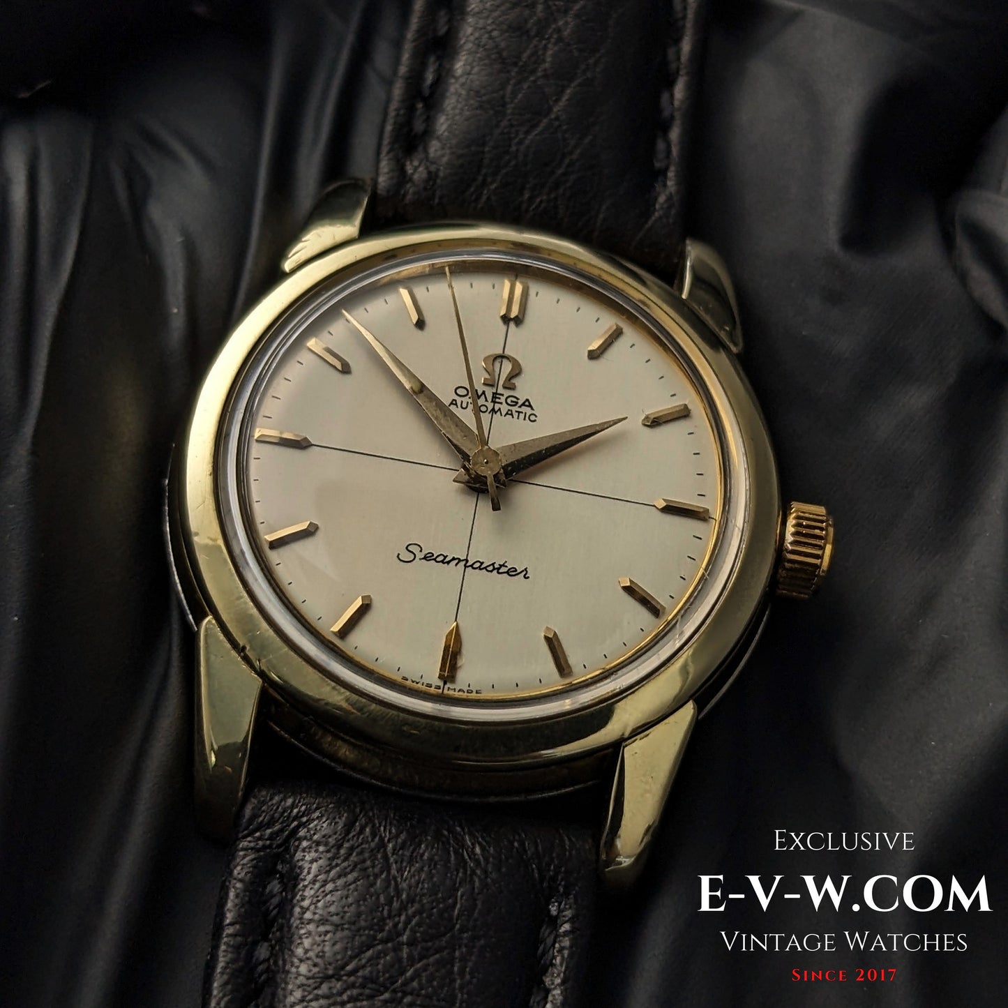 Detailed close-up of Omega Seamaster Ref. 2828-9SC Cal. 471 vintage watch with gold-tone case and cream dial on leather strap.