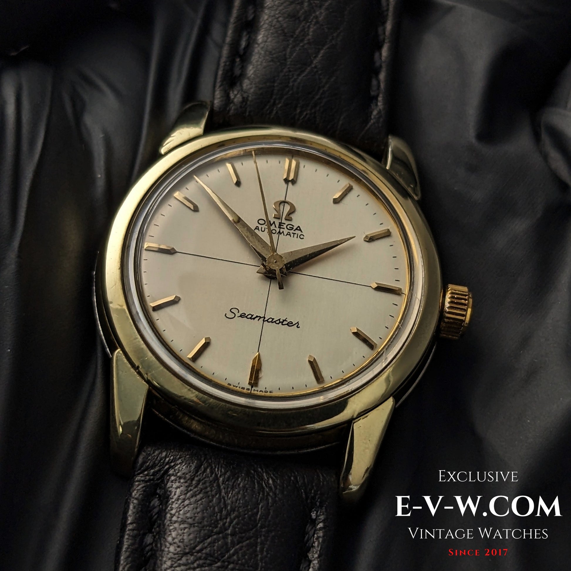 Detailed close-up of Omega Seamaster Ref. 2828-9SC Cal. 471 vintage watch with gold-tone case and cream dial on leather strap.