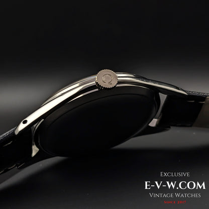 Crown view of Omega Jumbo 38mm Ref. 2505 20, featuring the Omega logo on the crown and a polished stainless steel case with a black leather strap.