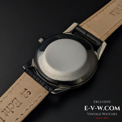 Back view of Vintage 1958 Omega Seamaster Automatic Watch showing polished stainless steel case back and leather strap.