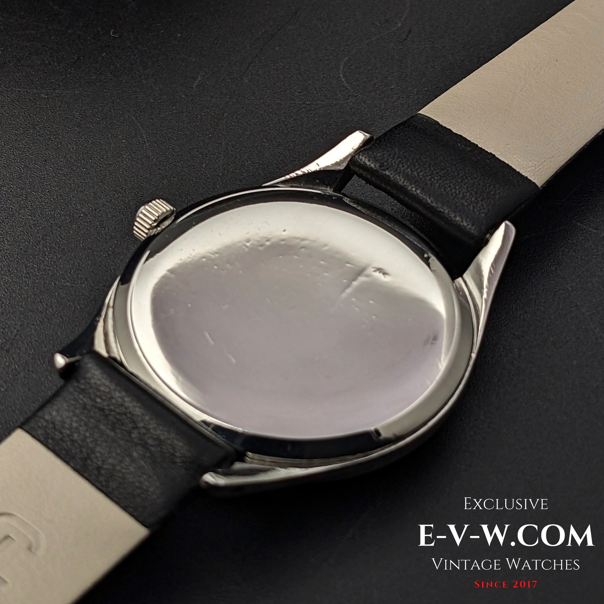 Back case of Omega Vintage 1952 Jumbo Ref. 2505 wristwatch, showing the polished steel surface with minor wear.