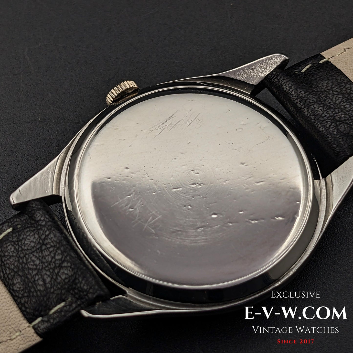 Case back of Omega Jumbo 38mm Ref. 2505 20, showing wear marks on the stainless steel surface, highlighting its vintage character.