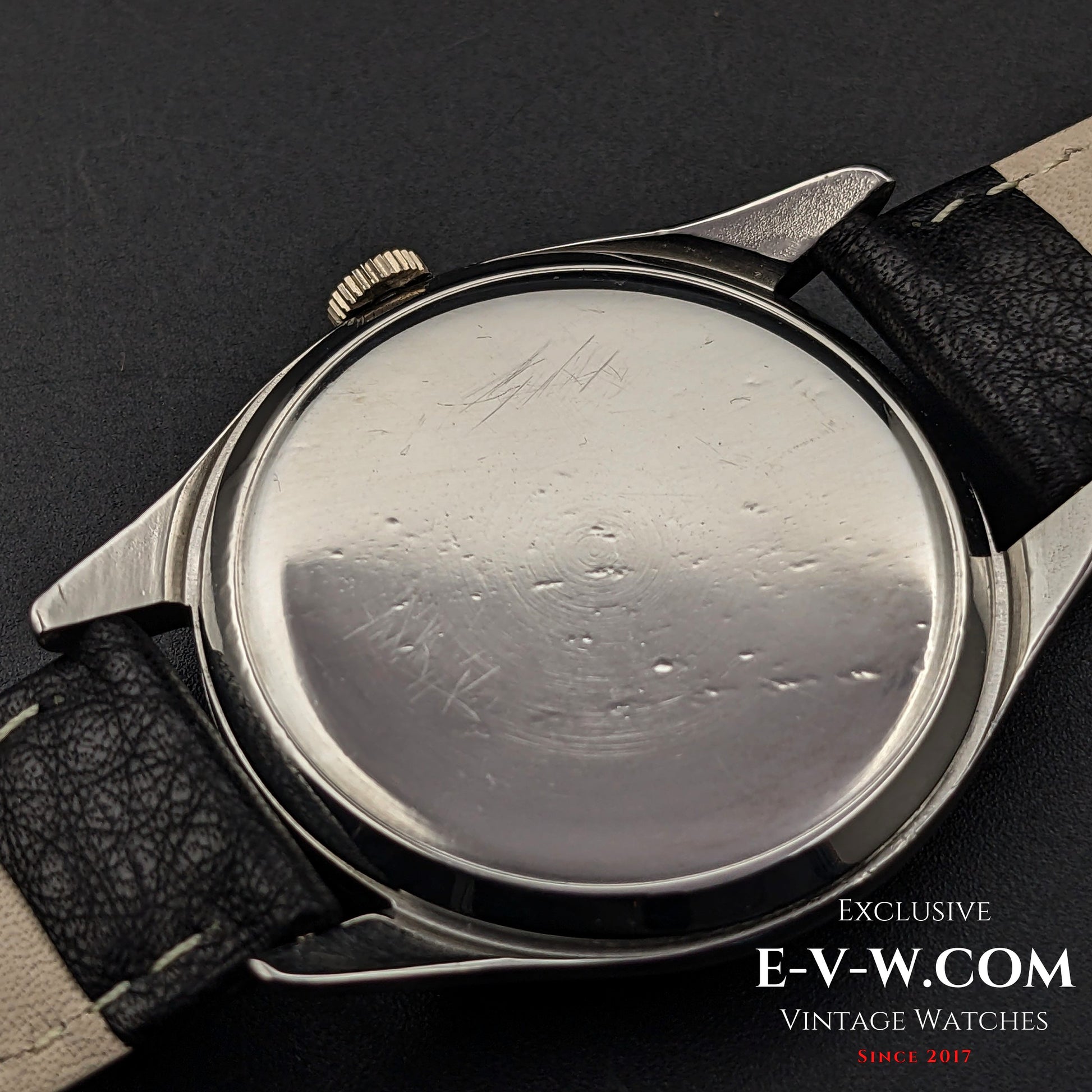 Case back of Omega Jumbo 38mm Ref. 2505 20, showing wear marks on the stainless steel surface, highlighting its vintage character.