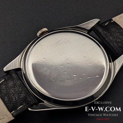 Case back of Omega Jumbo 38mm Ref. 2505 20, showing wear marks on the stainless steel surface, highlighting its vintage character.