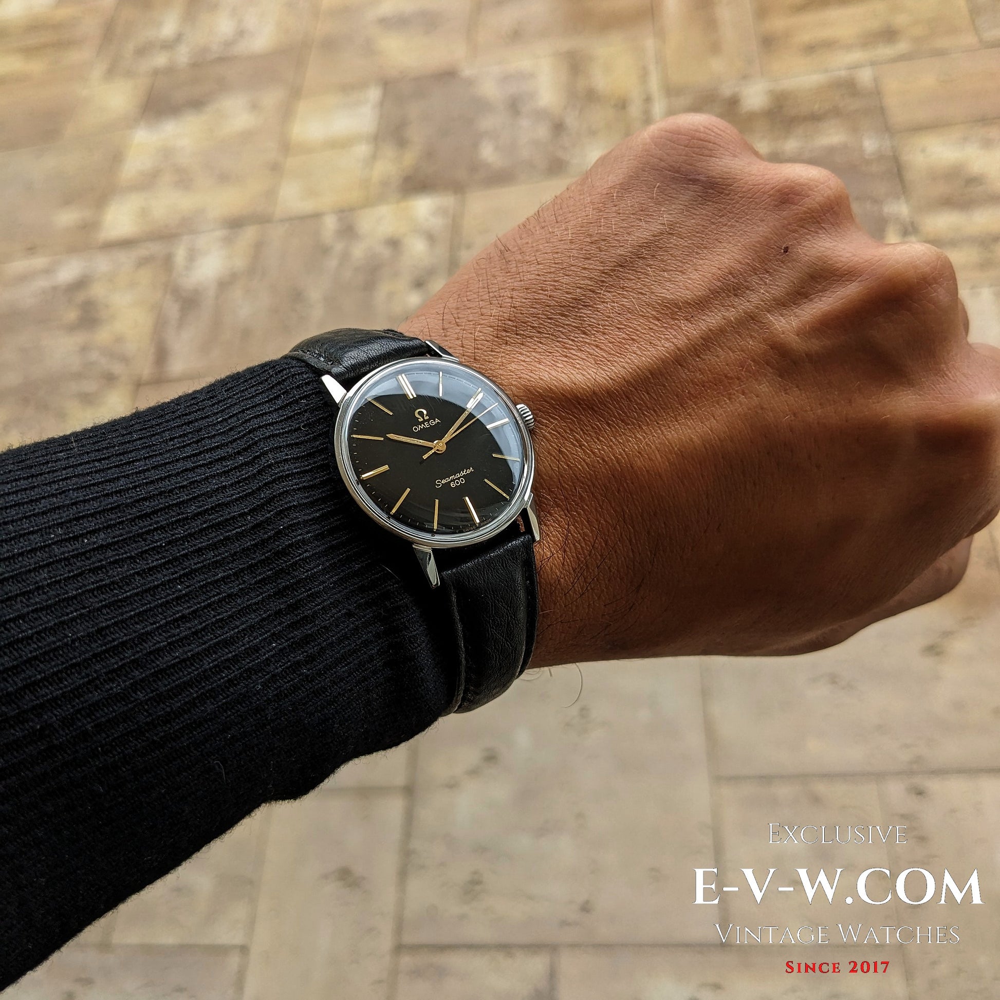 Omega Seamaster 600 1966 Ref. 135011 worn on wrist, showcasing its classic black and gold dial with vintage appeal and leather strap.
