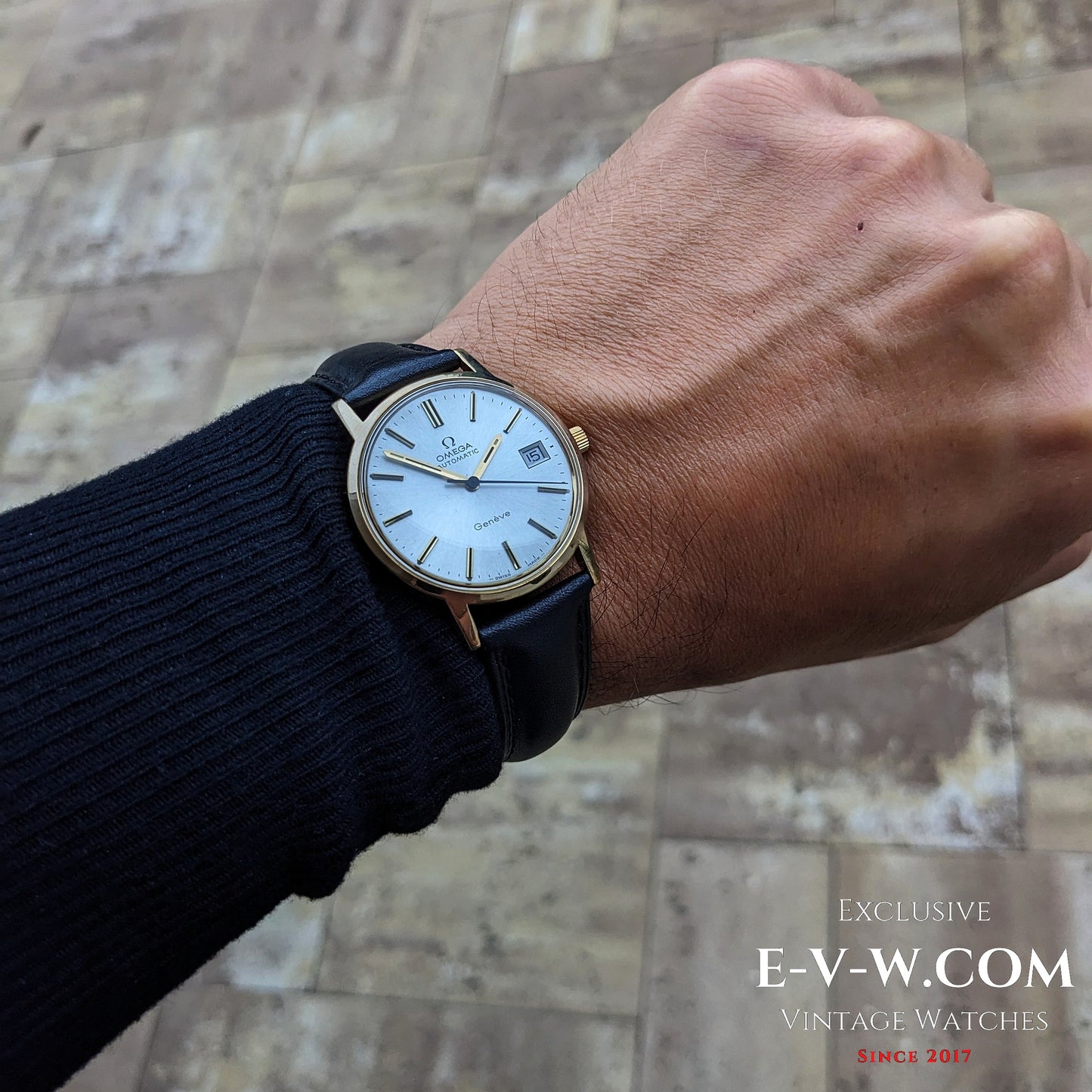 Omega Geneve 1973 Watch Ref. 1660163 worn on wrist, showcasing classic gold case and silver dial for timeless men's fashion.