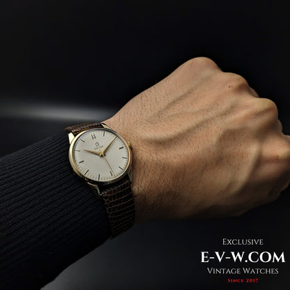 Vintage Omega Classic Gold Plaque watch worn on wrist, displaying its refined design and historical significance from 1952.
